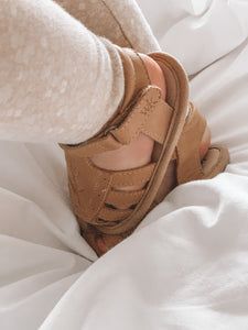 Baby Willow Sandal, made from soft wax leather, featuring a Willow leaf embroidery, soft suede soles, and a velcro strap, with a closed-in toe and heel design, perfect for both boys and girls.
