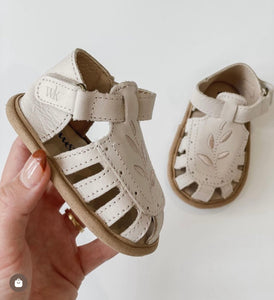 Baby Willow Sandal, made from soft wax leather, featuring a Willow leaf embroidery, soft suede soles, and a velcro strap, with a closed-in toe and heel design, perfect for first walking shoe.