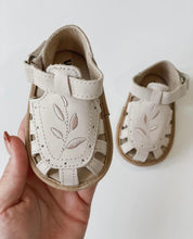 Load image into Gallery viewer, Baby Willow Sandal, made from soft wax leather, featuring a Willow leaf embroidery, soft suede soles, and a velcro strap, with a closed-in toe and heel design, perfect for first walking shoe.

