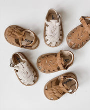 Load image into Gallery viewer, Baby Willow Sandal, made from soft wax leather, featuring a Willow leaf embroidery, soft suede soles, and a velcro strap, with a closed-in toe and heel design, perfect for both boys and girls.
